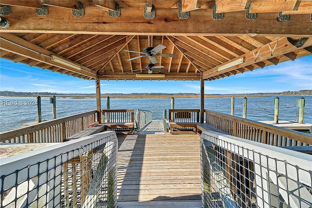 dock area with a gazebo and a water view