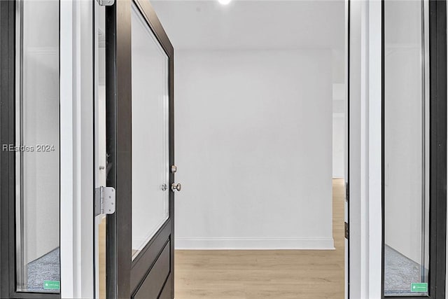 hallway featuring light wood-type flooring