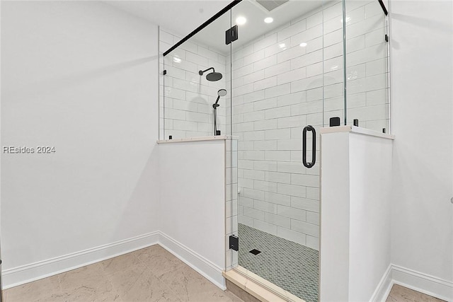 bathroom with a shower with shower door