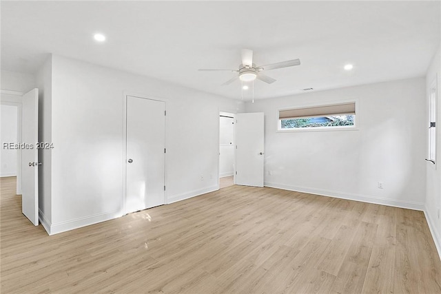 unfurnished bedroom featuring ceiling fan and light wood-type flooring