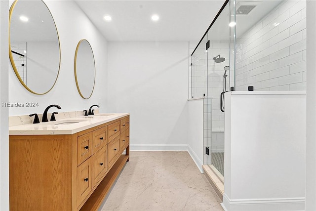 bathroom featuring vanity and a shower with shower door