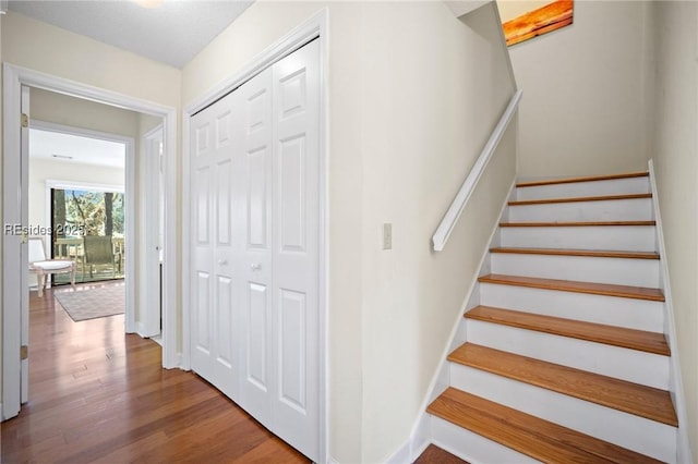 stairway featuring hardwood / wood-style floors