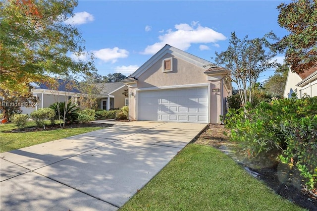 view of front facade with a garage and a front yard