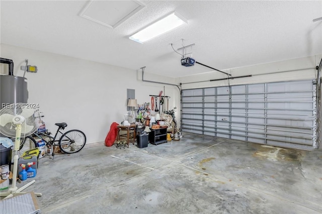 garage with a garage door opener and water heater