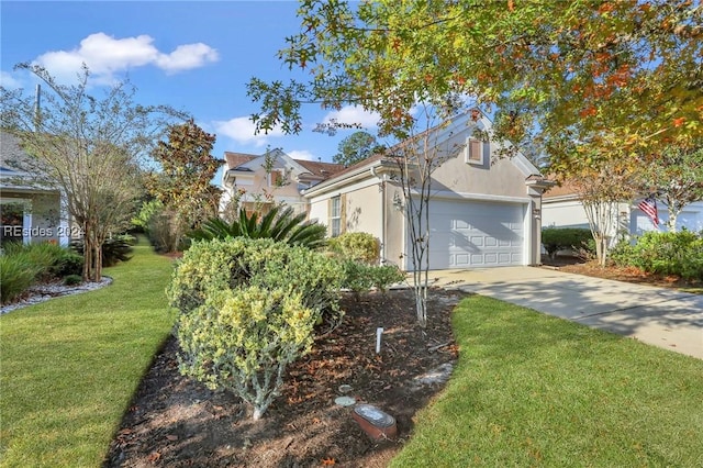 view of front of property with a garage and a front lawn