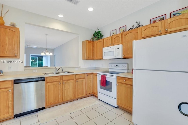 kitchen featuring sink, an inviting chandelier, decorative light fixtures, light tile patterned floors, and white appliances