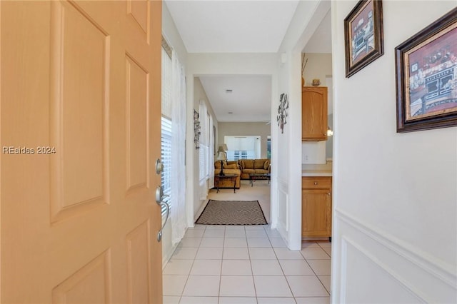 corridor featuring light tile patterned flooring