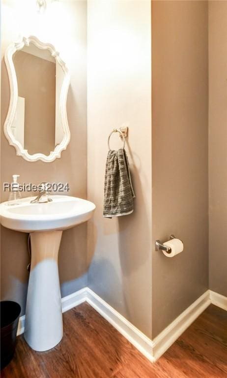 bathroom with wood-type flooring