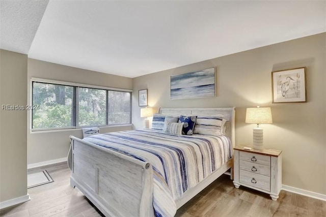 bedroom featuring hardwood / wood-style floors