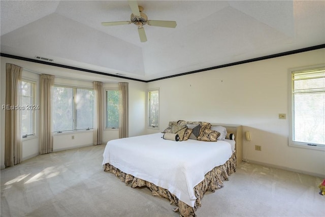 bedroom with ceiling fan, vaulted ceiling, and light carpet