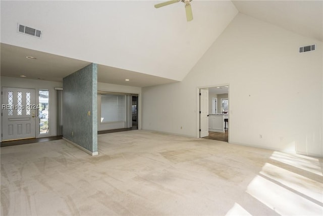 interior space featuring high vaulted ceiling and ceiling fan