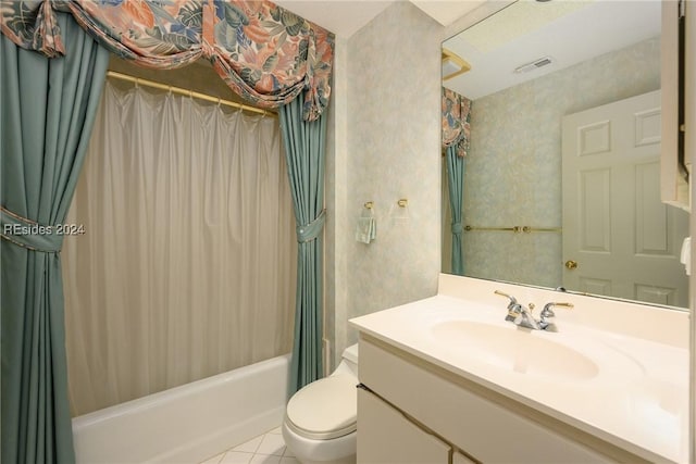 full bathroom featuring tile patterned flooring, shower / tub combo, vanity, and toilet