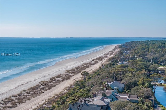 aerial view with a water view and a view of the beach