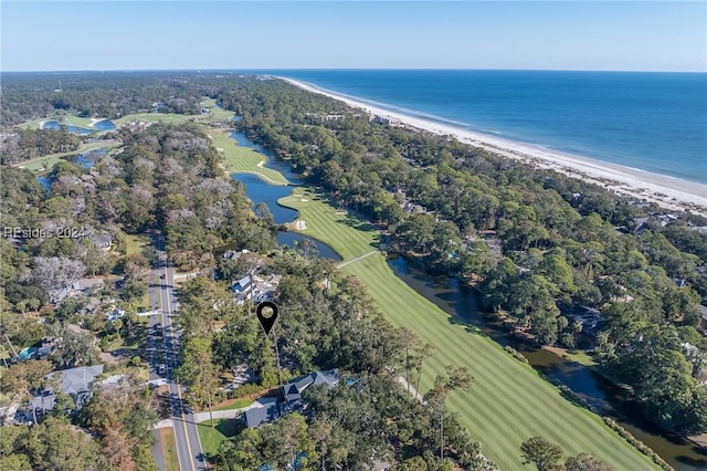 bird's eye view featuring a water view and a beach view