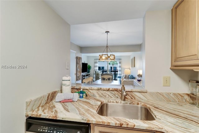 kitchen featuring sink, dishwasher, and light brown cabinets