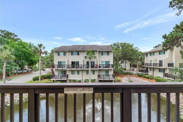 balcony featuring a water view