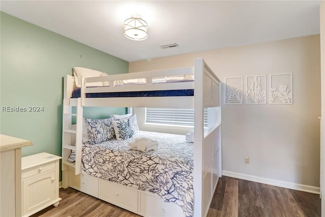 bedroom featuring wood-type flooring