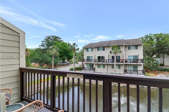 balcony featuring a water view