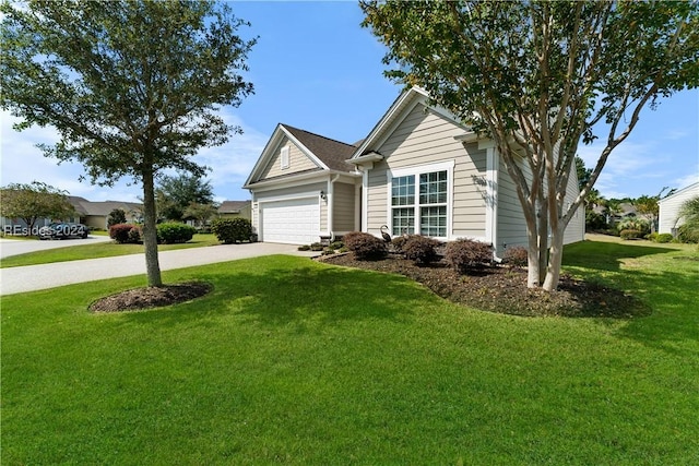 view of front facade with a garage and a front lawn