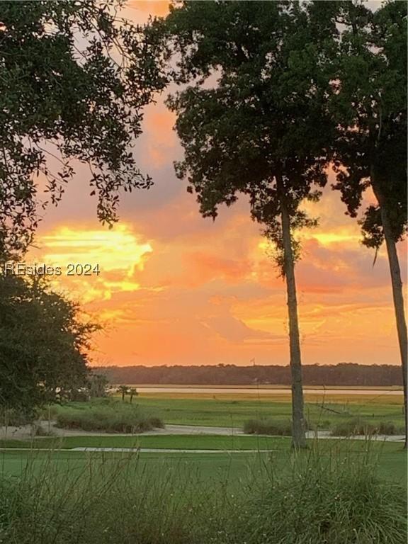 nature at dusk featuring a rural view