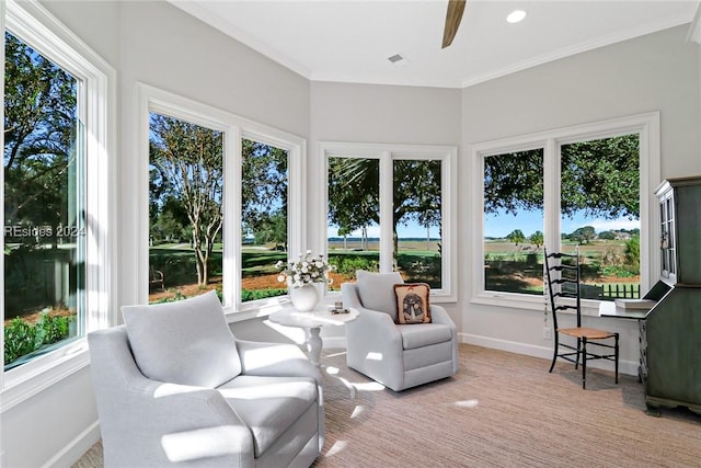 sunroom featuring ceiling fan