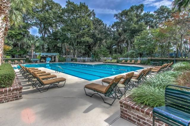 view of swimming pool featuring a patio area