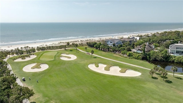 drone / aerial view featuring a water view and a beach view