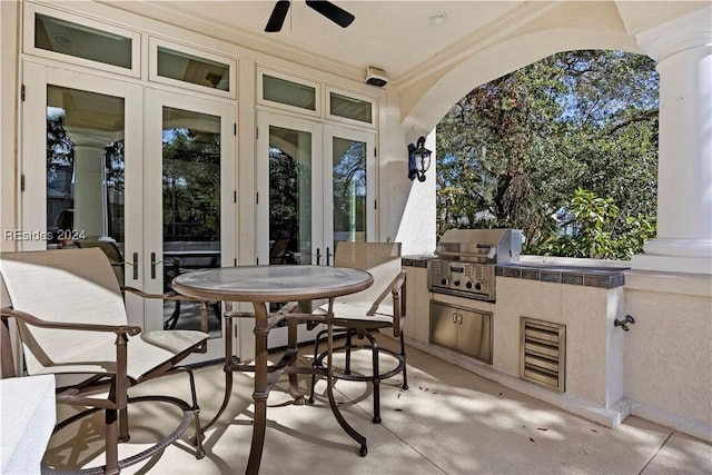 view of patio / terrace featuring area for grilling, a grill, and ceiling fan