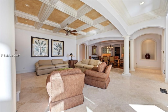 living room with decorative columns, crown molding, and coffered ceiling