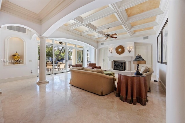 living room featuring ceiling fan, coffered ceiling, beam ceiling, and ornate columns