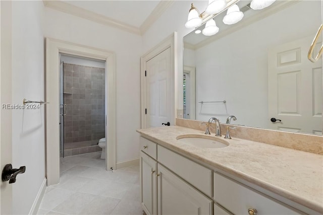 bathroom with vanity, ornamental molding, a shower with shower door, tile patterned floors, and toilet