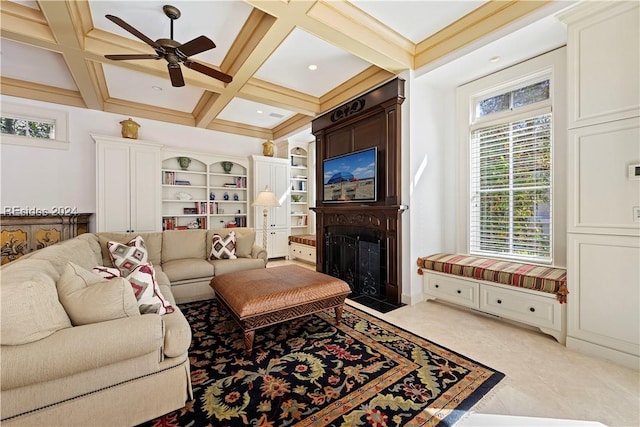 living room with beamed ceiling, ceiling fan, and coffered ceiling