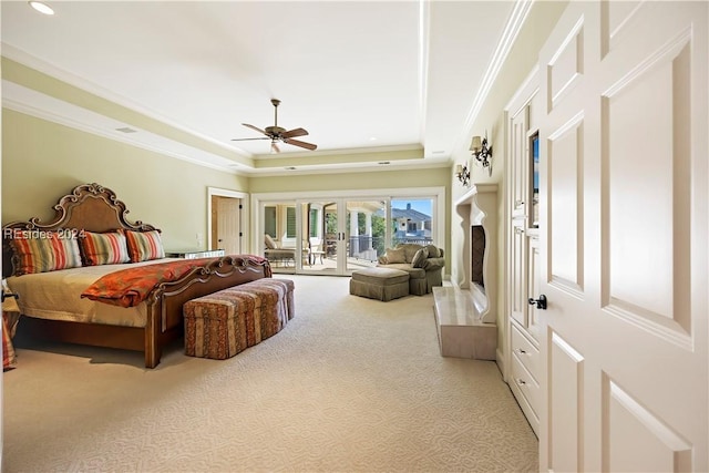 carpeted bedroom featuring ceiling fan, ornamental molding, french doors, access to outside, and a raised ceiling