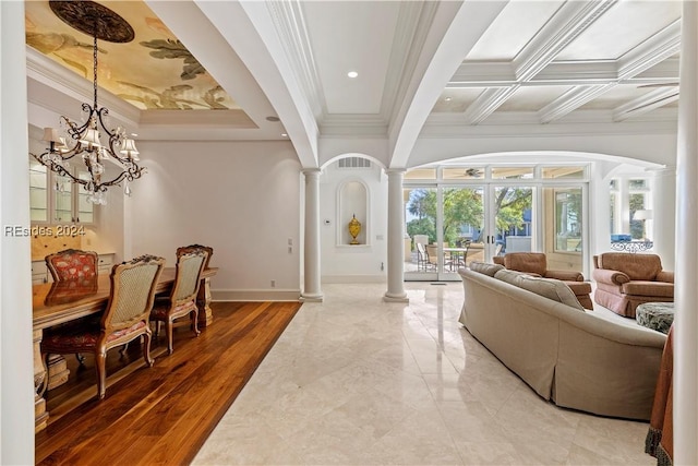 living room with crown molding, hardwood / wood-style floors, beam ceiling, decorative columns, and a notable chandelier