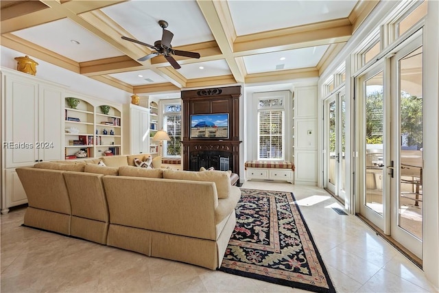 living room featuring coffered ceiling, plenty of natural light, built in features, and beamed ceiling