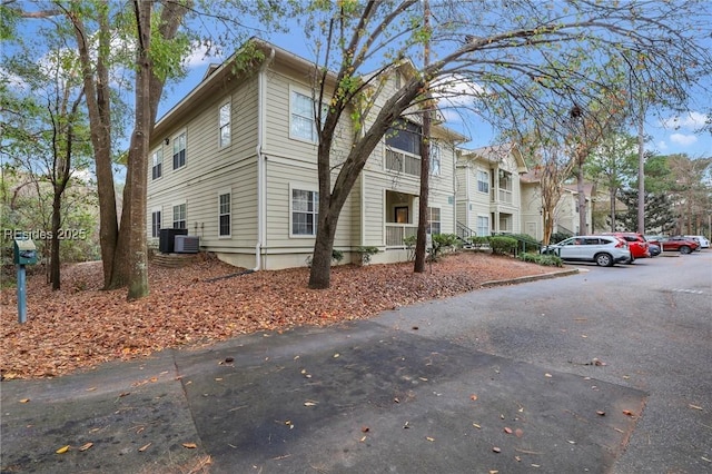 view of property exterior with central AC