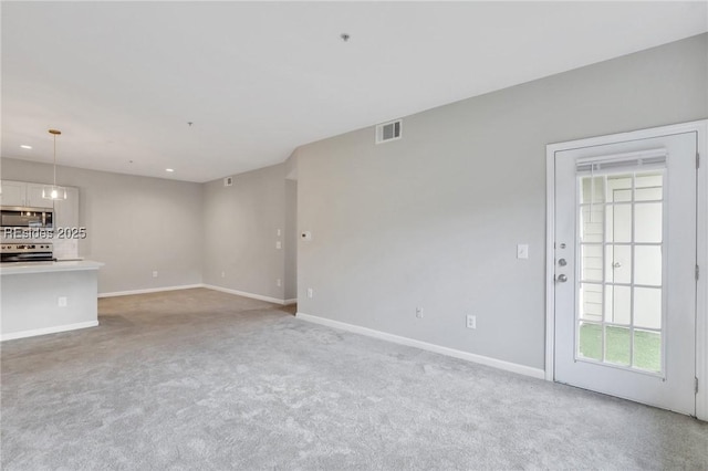 unfurnished living room with carpet