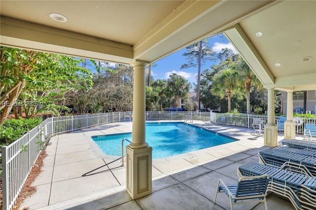 view of swimming pool with a patio area