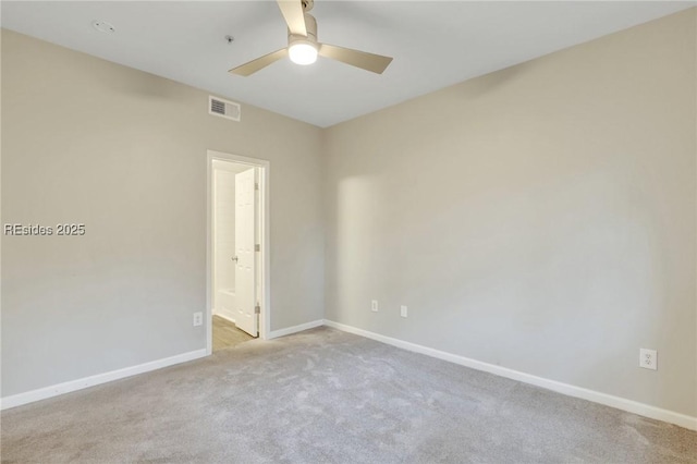 unfurnished room with light carpet and ceiling fan