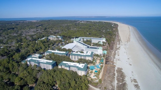 aerial view with a water view and a beach view