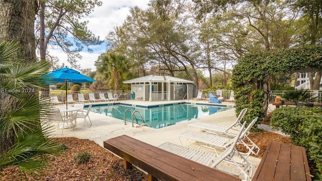 view of swimming pool featuring a patio area