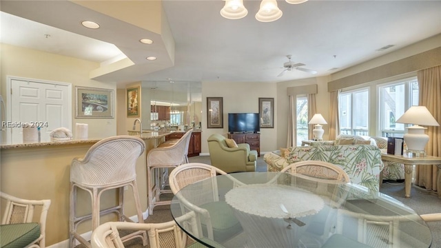 dining room featuring ceiling fan