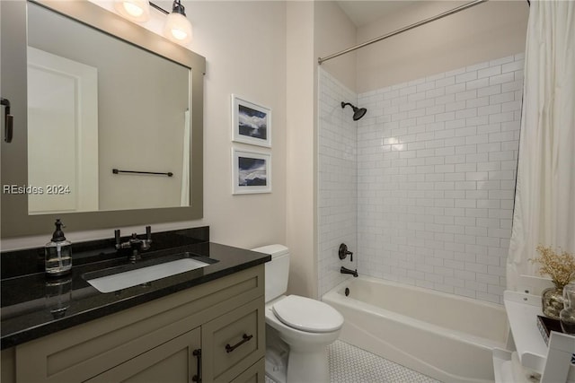 full bathroom featuring tile patterned flooring, vanity, toilet, and tiled shower / bath