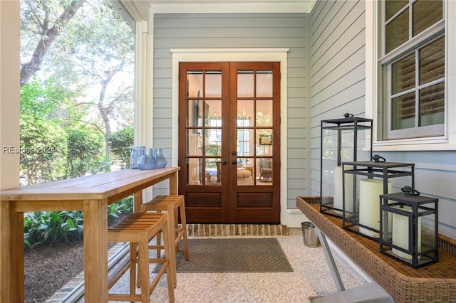 doorway featuring french doors and wood walls