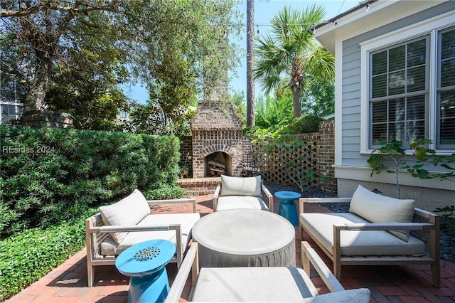 view of patio / terrace featuring an outdoor living space with a fireplace