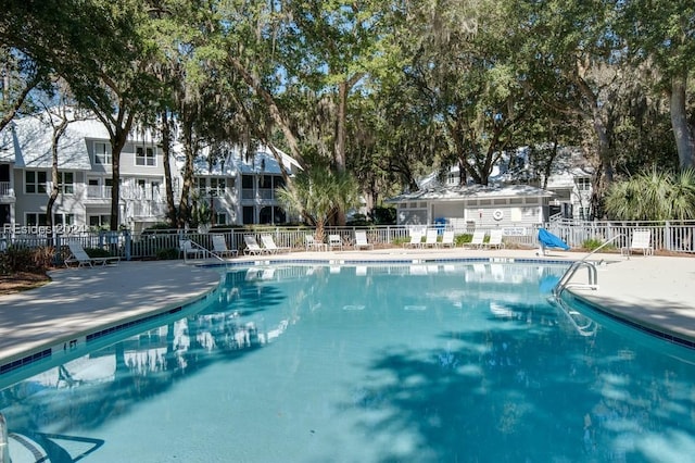 view of swimming pool with a patio area