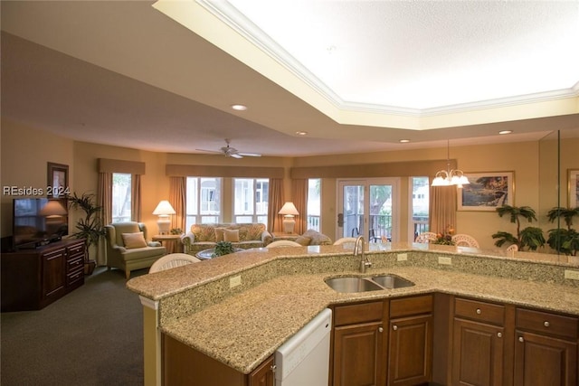 kitchen featuring sink, ornamental molding, light stone countertops, and dishwasher