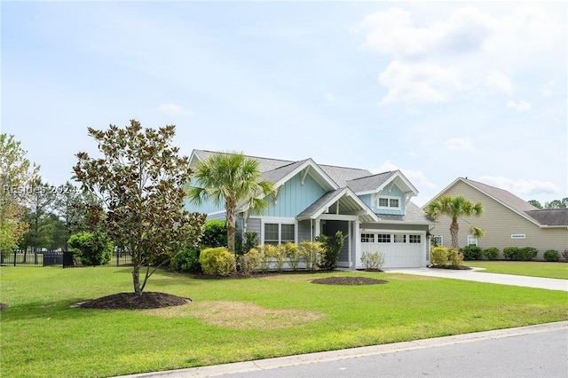 view of front of home featuring a garage and a front lawn