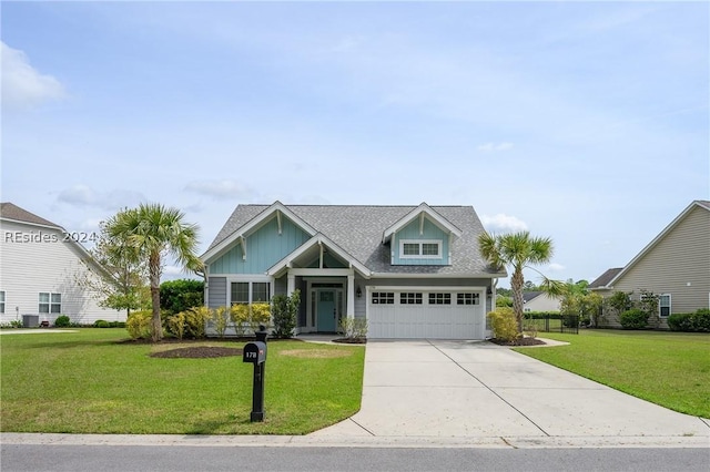 view of front of house featuring a garage and a front lawn