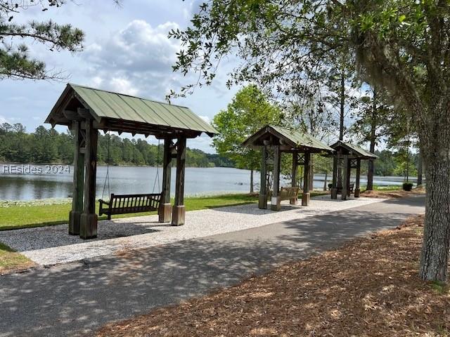 surrounding community featuring a water view